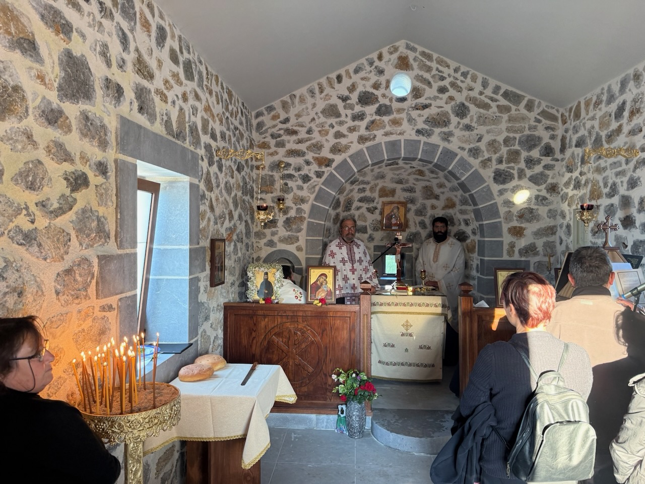 A service in a stone-vaulted village church